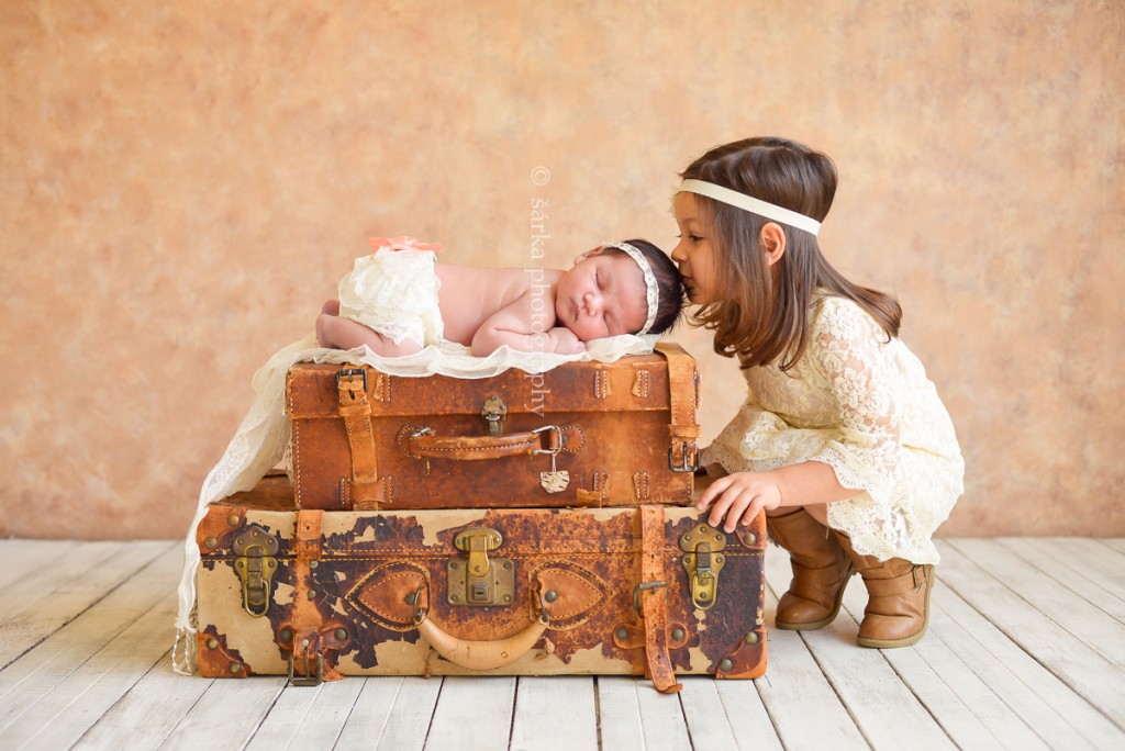 newborn baby girl with her older sister photographed by San Francisco and Marin Bay area newborn photographer Sarka Photography