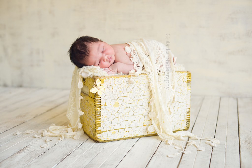 newborn baby girl sleeping on a vintage wooden box photographed by San Francisco and Marin Bay area newborn photographer Sarka Photography