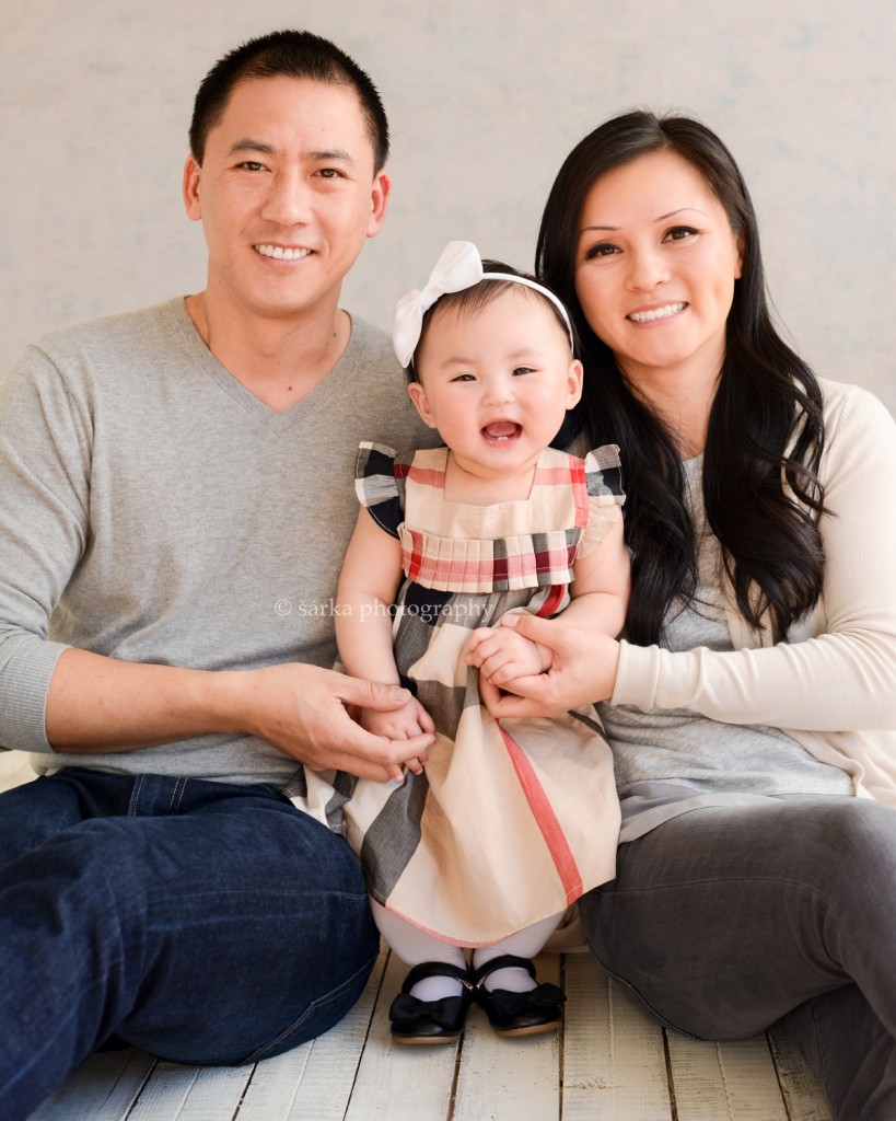 one year old baby girl standing by her parents photographed by San Francisco Bay Area photographer Sarka Photography