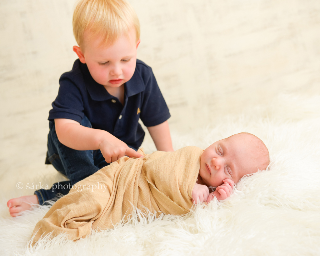 newborn boy sleeping next to his older brother photographed by San Francisco Bay Area newborn and baby photographer Sarka Photography