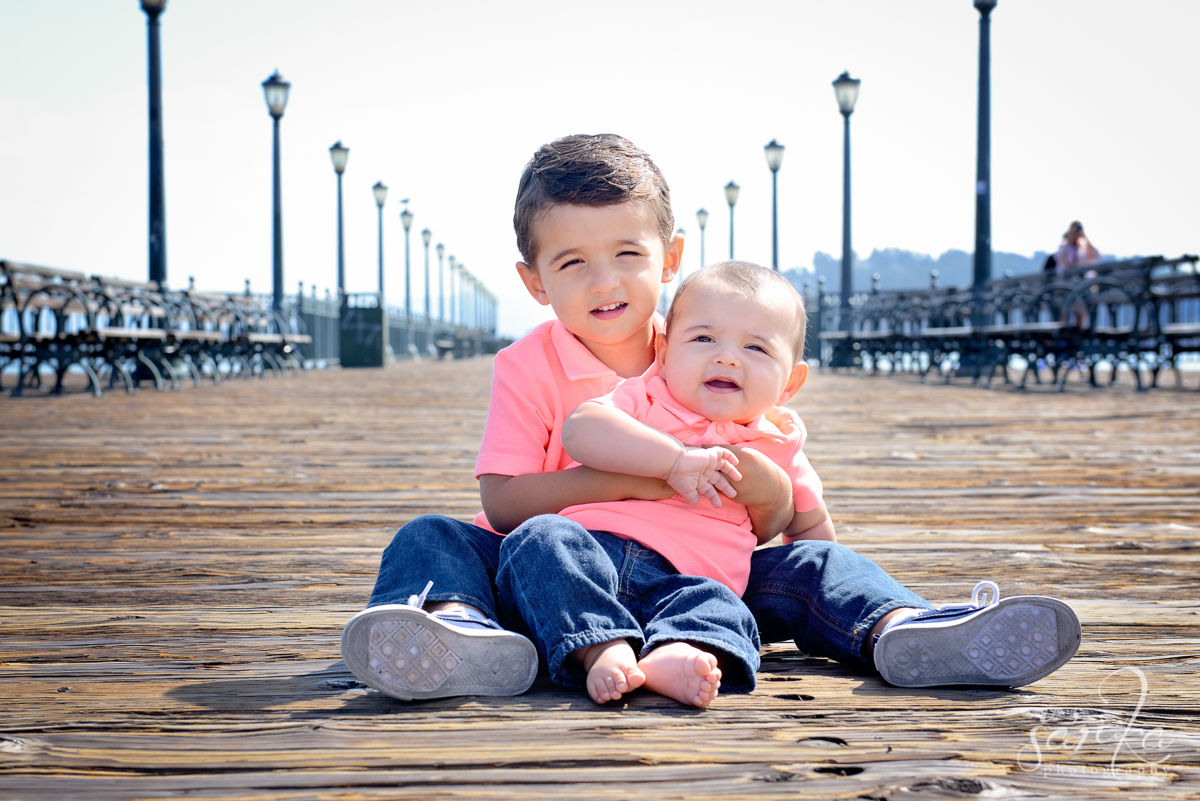 two little boys sitting on San Francisco pier photographed by San Francisco Baby and children photographer Sarka Photography