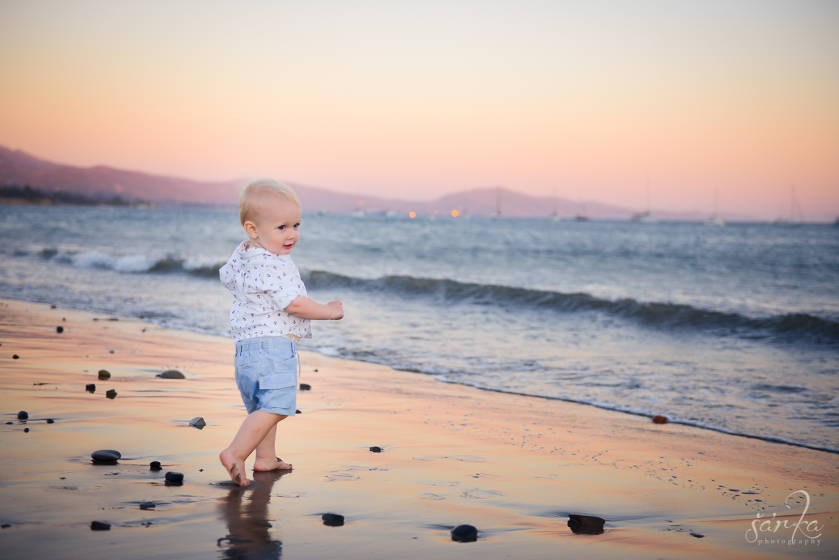 toddler boy walking on the beach at sunset photographed by Santa Barbara baby photographer Sarka Photography