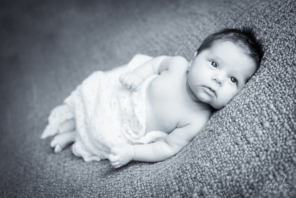 newborn baby girl lying on a blanket photographed by San Francisco Bay Area newborn and baby photographer Sarka Photography