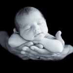 newborn baby boy sleeping in dads arms photographed by San Francisco Bay Area and Santa Barbara baby photographer Sarka Photography