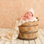 newborn baby girl sleeping in a vintage bucket photographed by San Francisco Bay Area and Santa Barbara baby photographer Sarka Photography