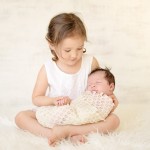 newborn baby with older sibling photographed by San Francisco Bay Area and Santa Barbara baby photographer Sarka Photography