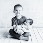 newborn baby with older sibling photographed by San Francisco Bay Area and Santa Barbara baby photographer Sarka Photography