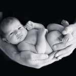 newborn baby in dads arms photographed by San Francisco Bay Area and Santa Barbara baby photographer Sarka Photography