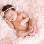 newborn baby girl sleeping on a pink fuzzy blanket photographed by San Francisco Bay Area and Santa Barbara baby photographer Sarka Photography