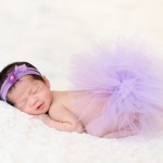 newborn baby girl sleeping on a pink blanket with a pink tutu photographed by San Francisco Bay Area and Santa Barbara baby photographer Sarka Photography