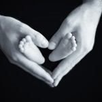 newborn feet in parents hands photographed by San Francisco Bay Area and Santa Barbara baby photographer Sarka Photography