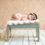 newborn baby girl sleeping on a vintage wood stool photographed by San Francisco Bay Area and Santa Barbara baby photographer Sarka Photography