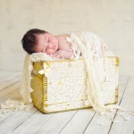 newborn baby girl sleeping on a vintage wood box photographed by San Francisco Bay Area and Santa Barbara baby photographer Sarka Photography