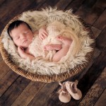 newborn baby sleeping in a basket hat photographed by San Francisco Bay Area and Santa Barbara baby photographer Sarka Photography