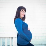 pregnant woman standing by a building photographed by Santa Barbara and San Francisco Bay area photographer Sarka Photography