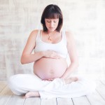 pregnant woman in a yoga pose photographed by Santa Barbara and San Francisco Bay area photographer Sarka Photography