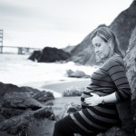 pregnant woman at china beach pregnant woman showing off her belly photographed by Santa Barbara and San Francisco Bay area photographer Sarka Photography