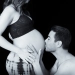 husband kissing wife pregnant belly photographed by Santa Barbara and San Francisco Bay area photographer Sarka Photography