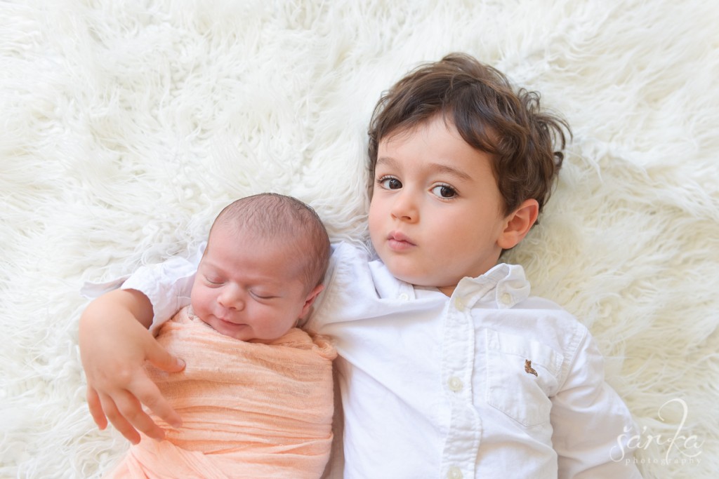 newborn baby girl with her older brother photographed by San Francisco Bay area baby photographer Sarka photography