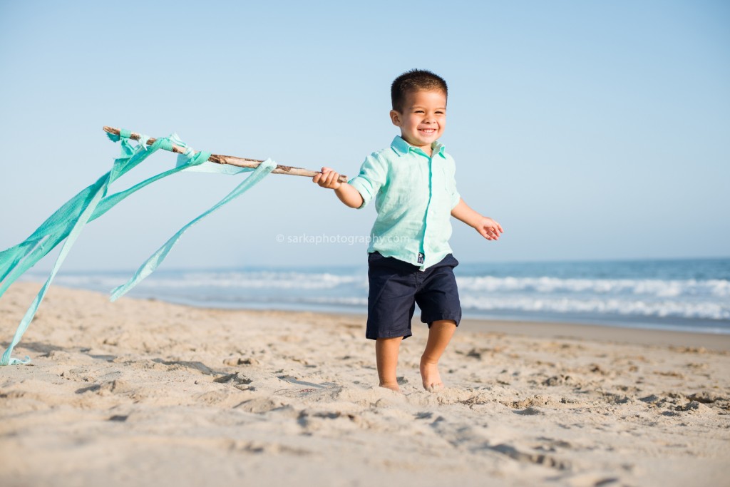 toddler boy running on the beach photographed by Santa Barbara children photographer Sarka Photography