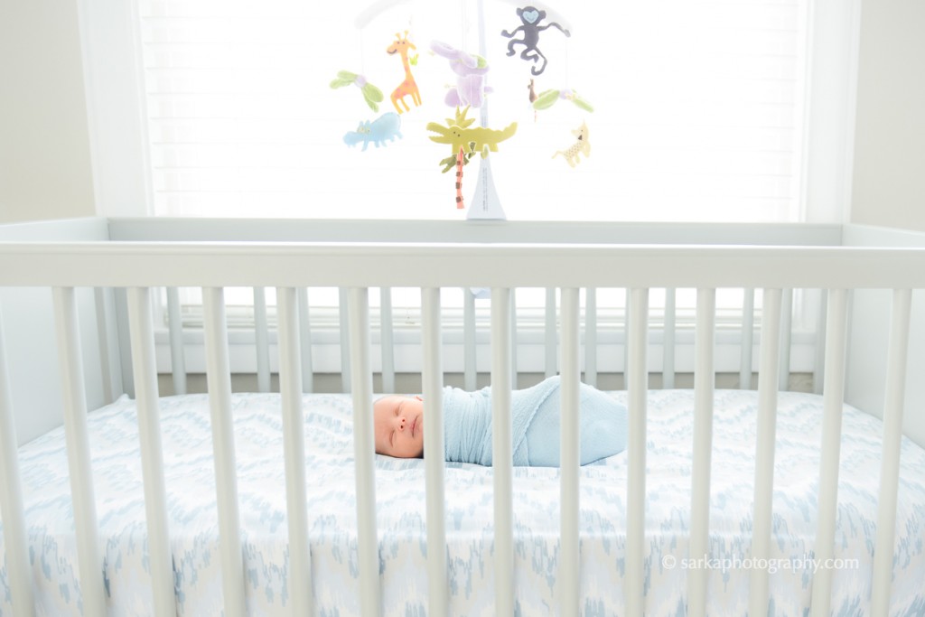 newborn baby boy sleeping in his baby crib photographed by San Francisco and Santa Barbara baby photographer Sarka Photography