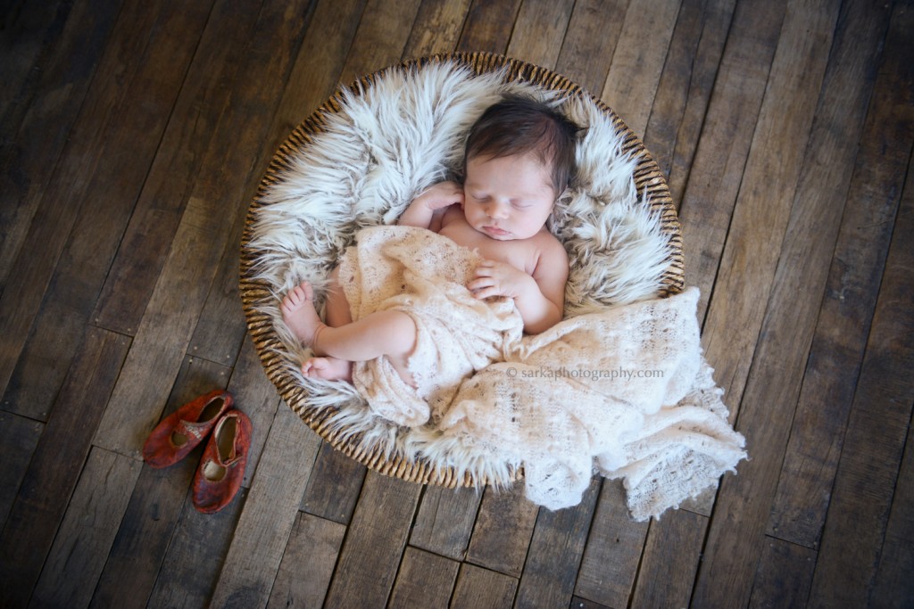 newborn baby girl sleeping in a basket photographed by Santa Barbara newborn photographer Sarka photography