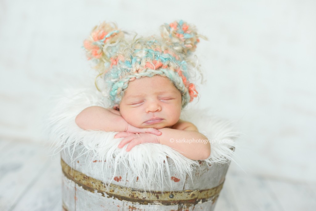 newborn baby girl sleeping in a vintage bucket photographed by San Francisco Bay area and Santa Barbara baby photographer Sarka Photography