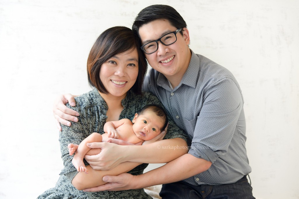 new parents holding their newborn baby boy photographed by San Francisco East Bay Area baby photographer Sarka Photography