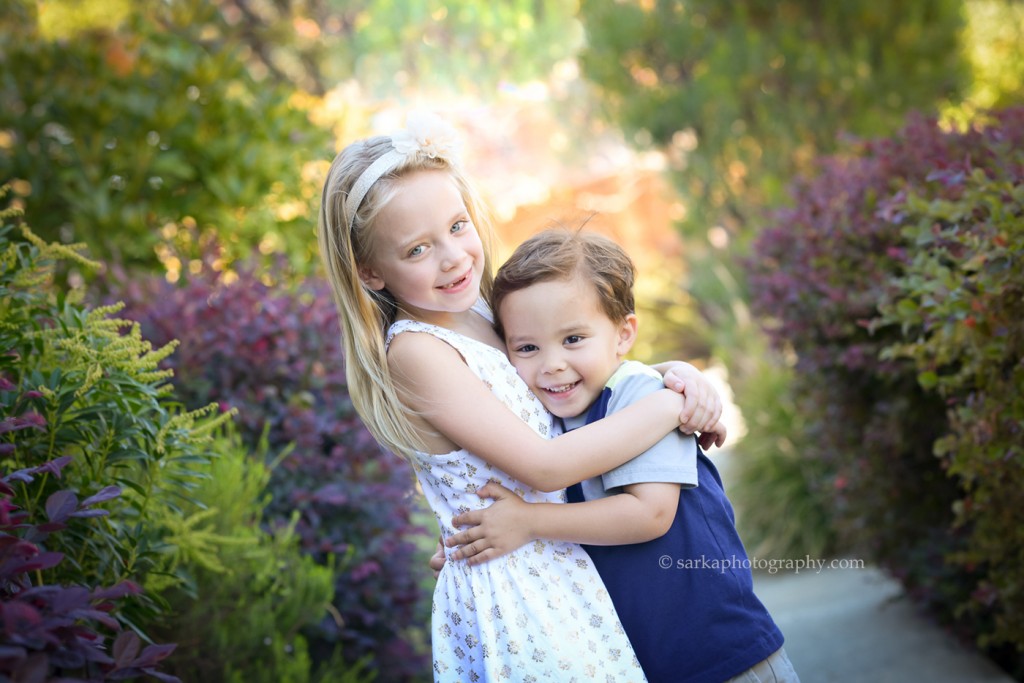 siblings hugging each other photographed by Bay Area family photographer Sarka Photography