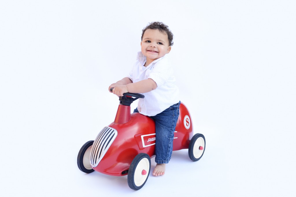 one year baby boy sitting on a radio flyer photographed by San Francisco Bay area baby photographer Sarka photography