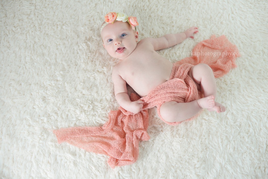 four month old baby girl on a furry blanket photographed by Santa Barbara and Bay Area Sarka photography