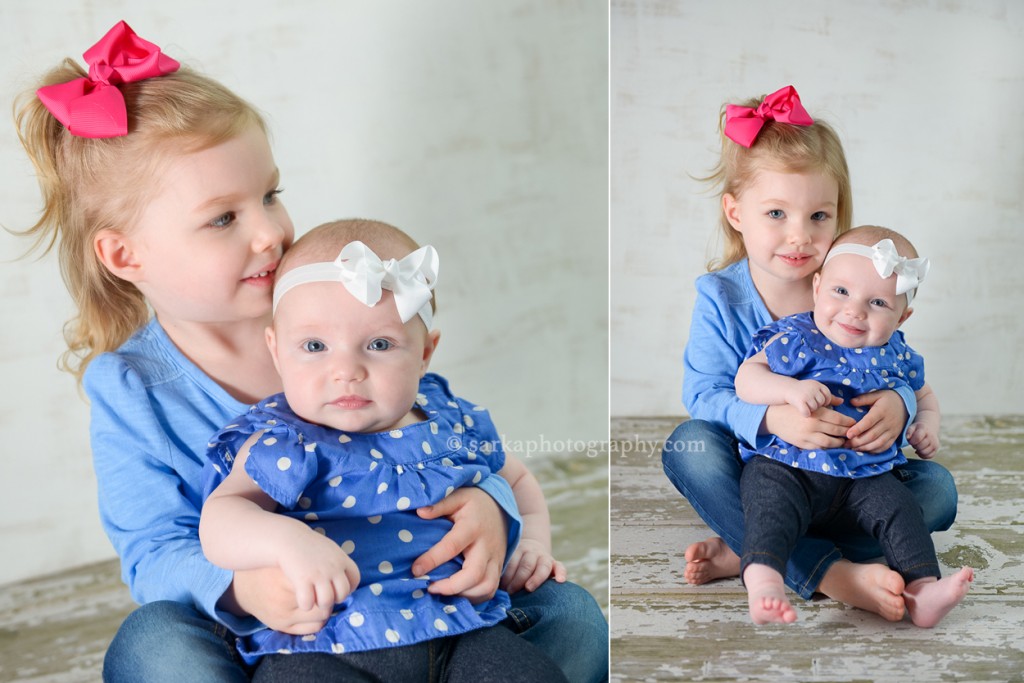 baby girl sitting in her sisters lap photographed by Santa Barbara and Bay Area Sarka photography