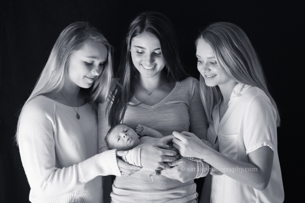 timeless family portrait of three sisters holding their newborn brother by Marin baby photographer Sarka
