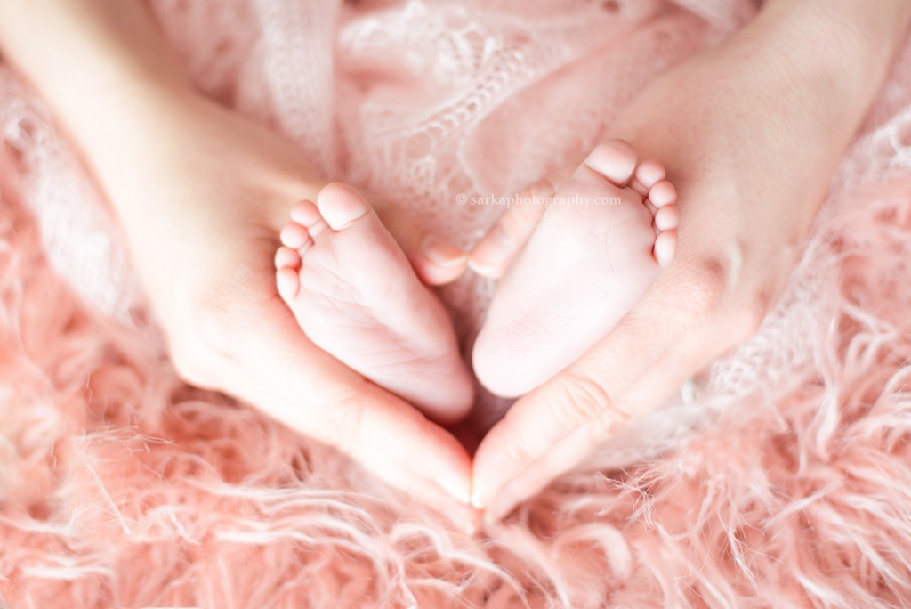 newborn feet in mother's hands photographed by Santa Barbara and San Jose Baby photographer Sarka Photography
