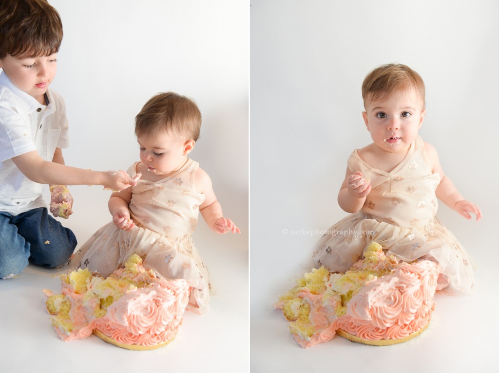 one year baby girl smashing birthday cake photographed by San Francisco and Santa Barbara baby photographer Sarka