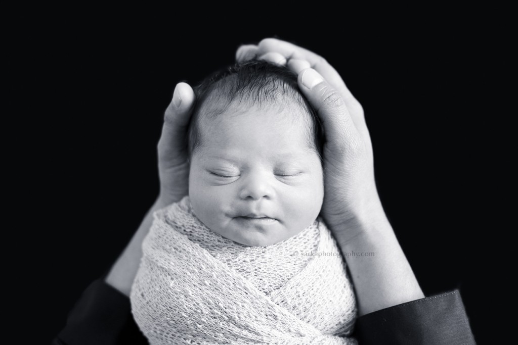 newborn baby girl sleeping in her dad's hands portrait by Santa Barbara Thousand Oaks Malibu baby newborn and family photographer Sarka photography