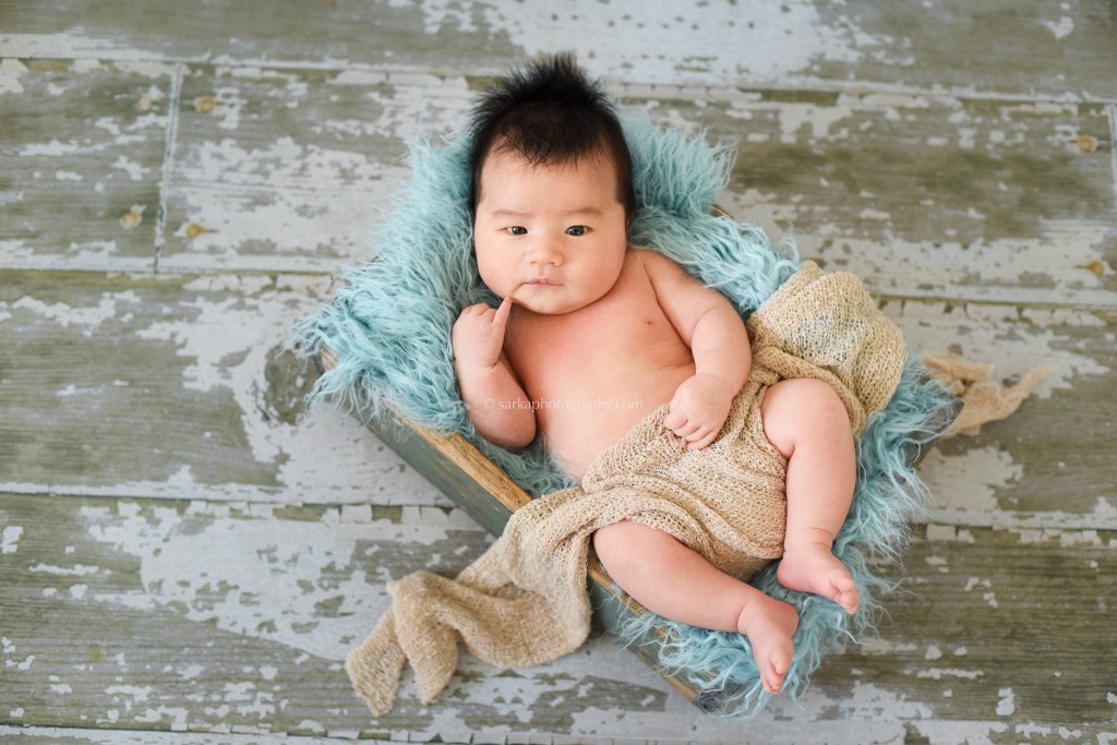 baby boy in a wooden box photographed by Santa Barbara and Burlingame baby photographer Sarka Photography
