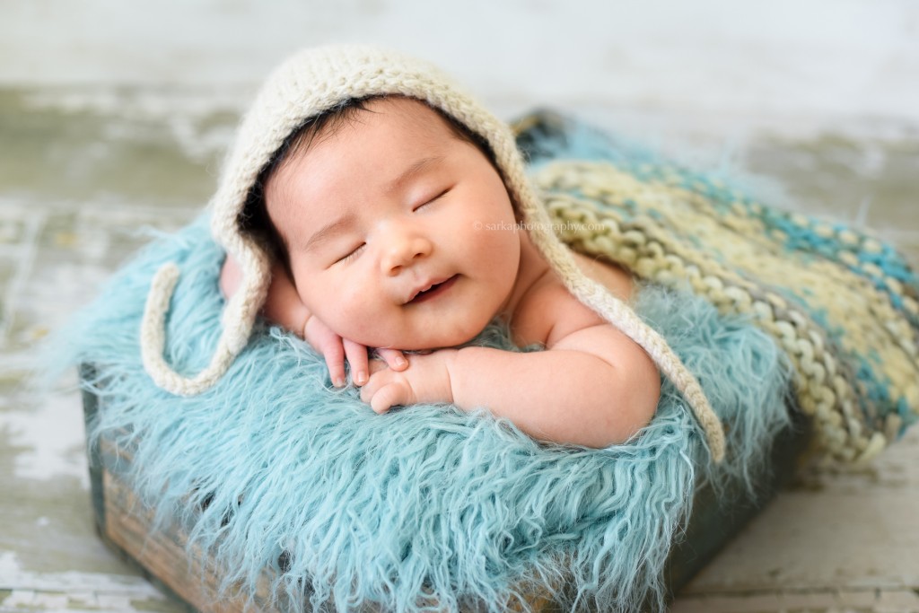 baby boy sleeping and smiling photographed by Santa Barbara and Burlingame baby photographer Sarka Photography