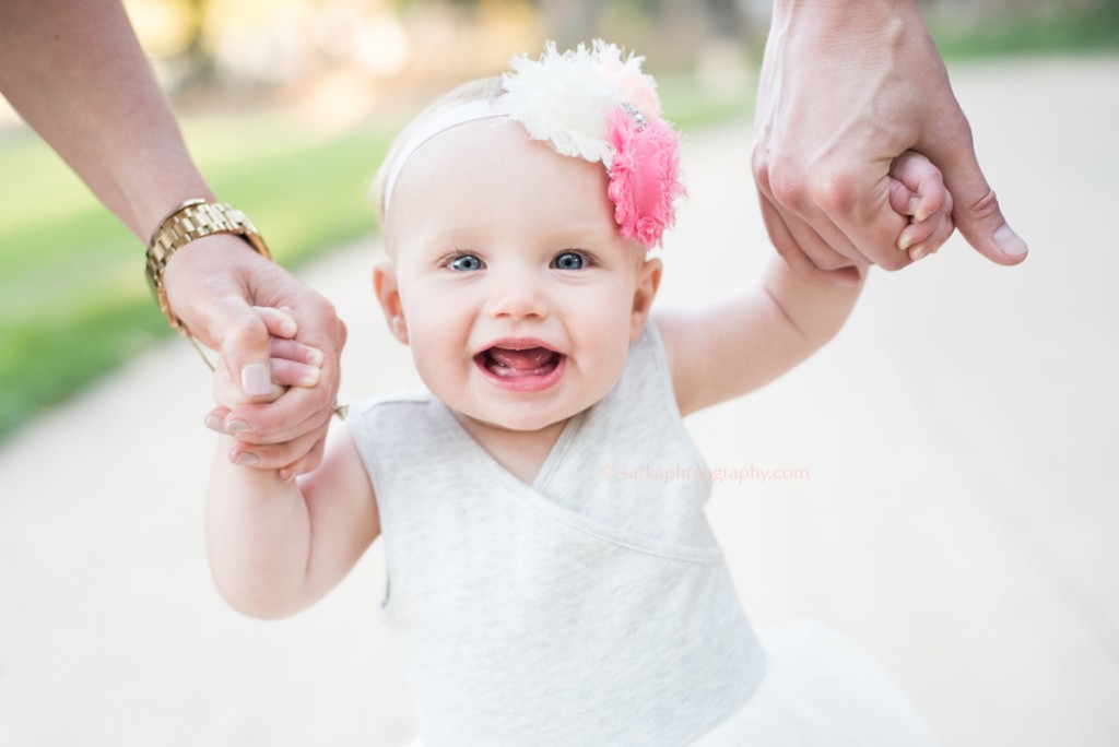 9month baby girl holding her parents hands photographed by San Francisco Bay Area and Santa Barbara children photographer Sarka