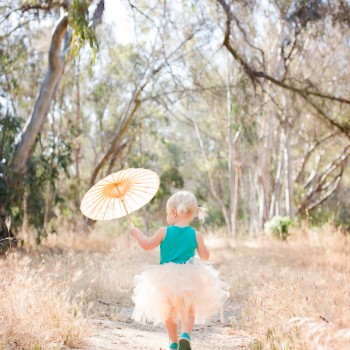little girl walking on a woodsy path photographed by artistic children photographer in santa barbara and montecito by sarkaphotography