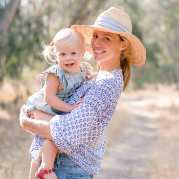 young mom holding her toddler daughter for a mommy and me portrait photographed by santa barbara montecito carpinteria children photographer sarkaphotography