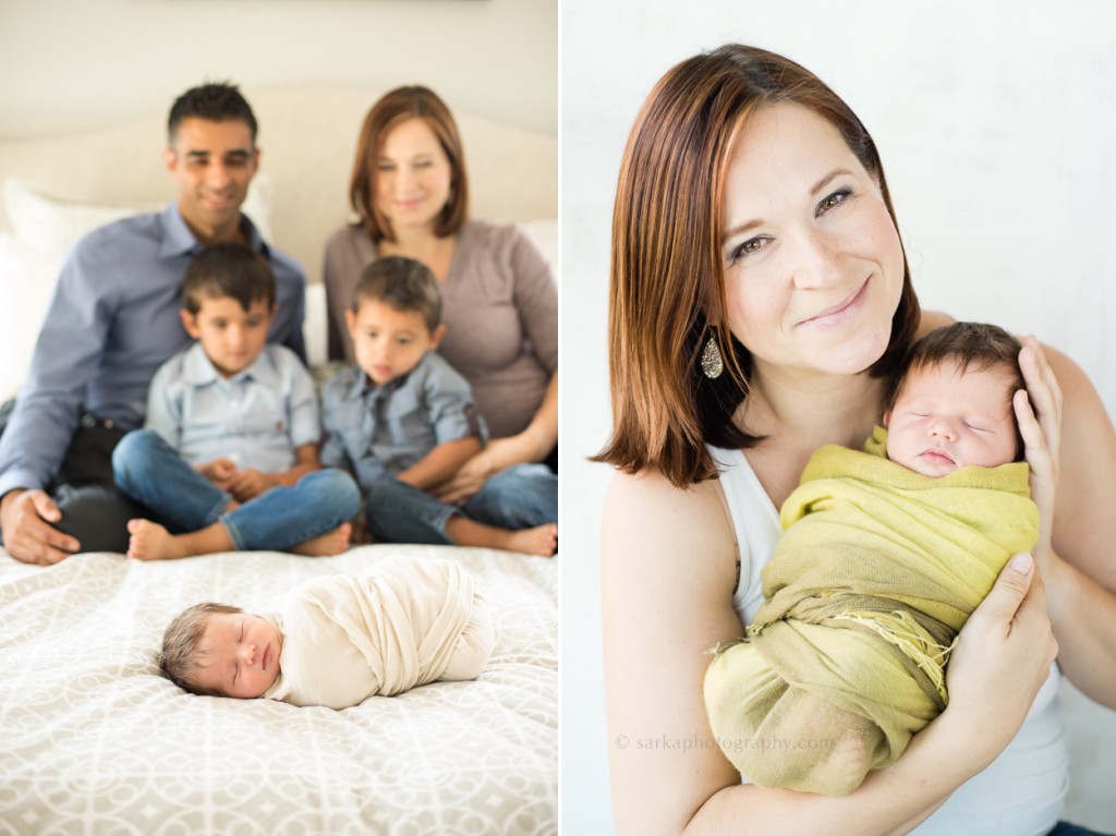family sitting on the bed with their newborn baby photographed by Sarkaphotography
