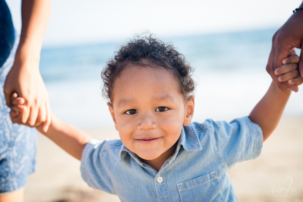 young toddler boy portrait on the beach by santa barbara children photographer sarka