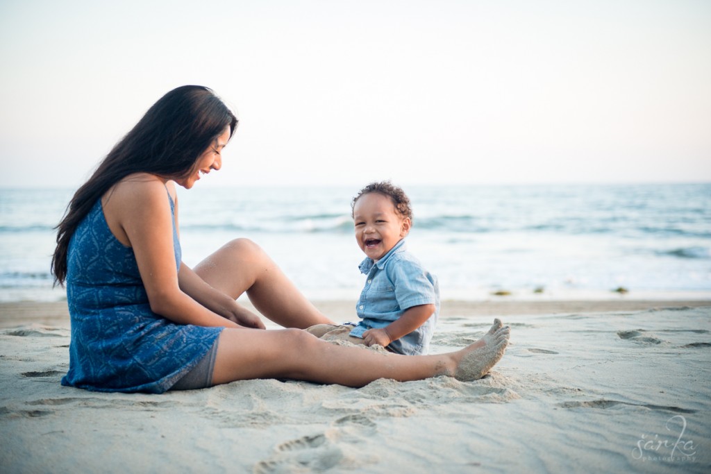 mom playing withher son on the beach during a family photo session by santa barbara family photographer sarka
