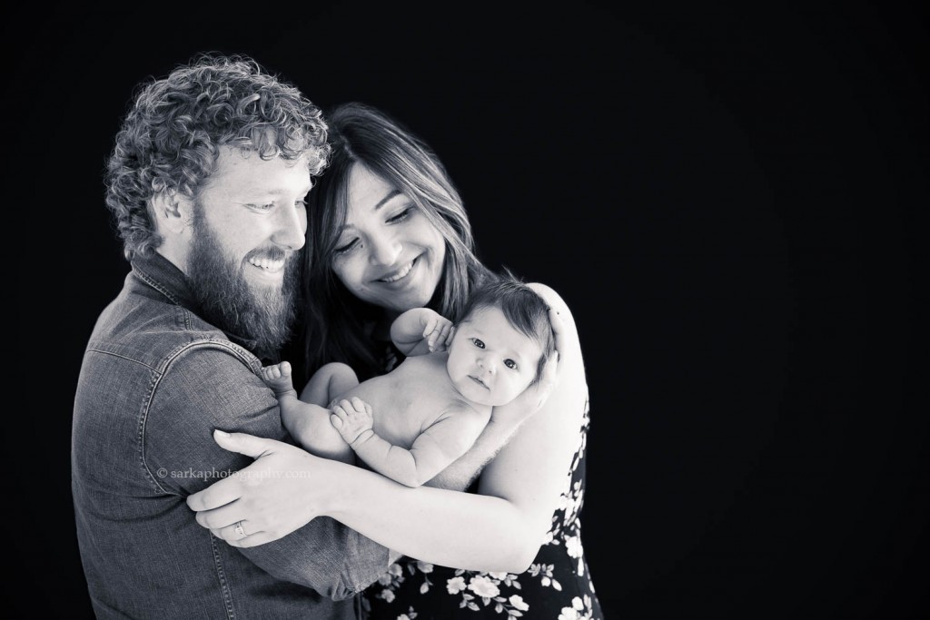 black and white portrait of new parents holding their sweet newborn baby girl photographed by Santa Barbara Carpinteria Montecito newborn photographer Sarka Photography