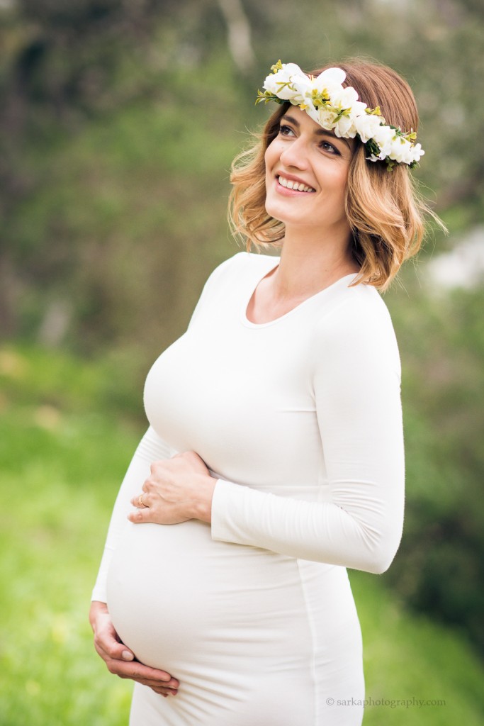 young expecting mother smiling during her maternity photo session portraits in Santa Barbara photographed by sarkaphotography