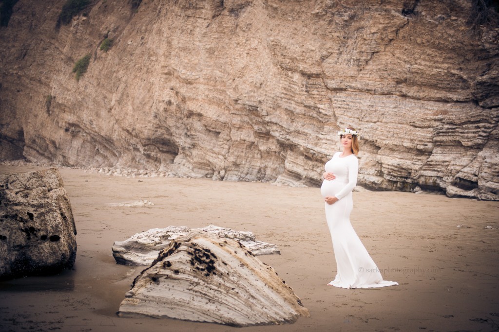 expecting mama to be at her maternity beach photo session in Santa Barbara photographed by sarkaphotography