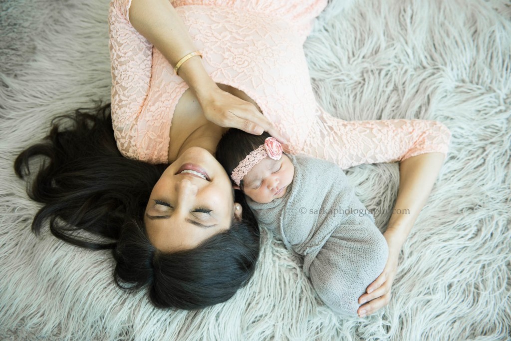newborn baby girl snuggling with her mom photographed by San Francisco Bay Area and Santa Barbara baby photographer sarkaphotography