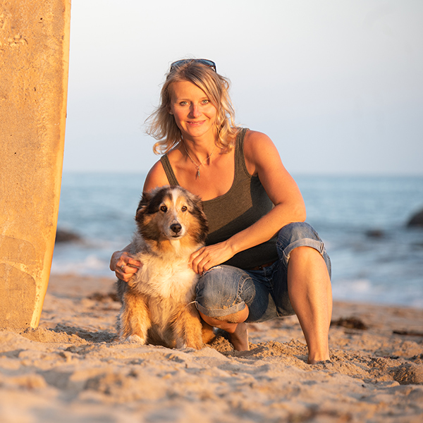 Santa Barbara pet photographer Sarka with her dog on the beach