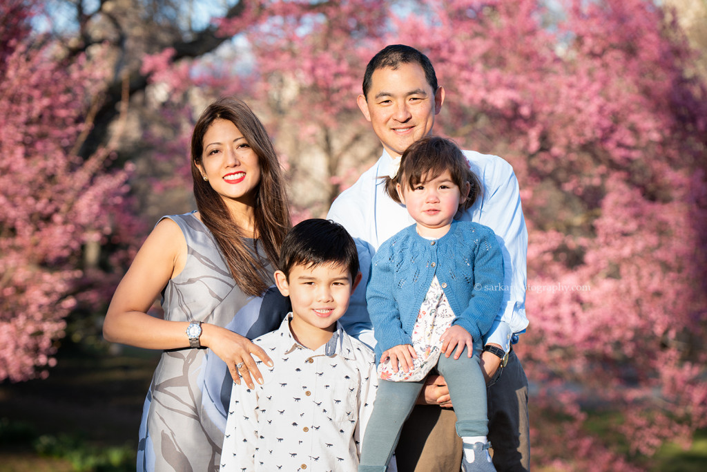 young family portrait in front of spring blooms in Central Park New York